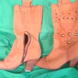 Cowgirl beautiful soft suede brownish orange boots.